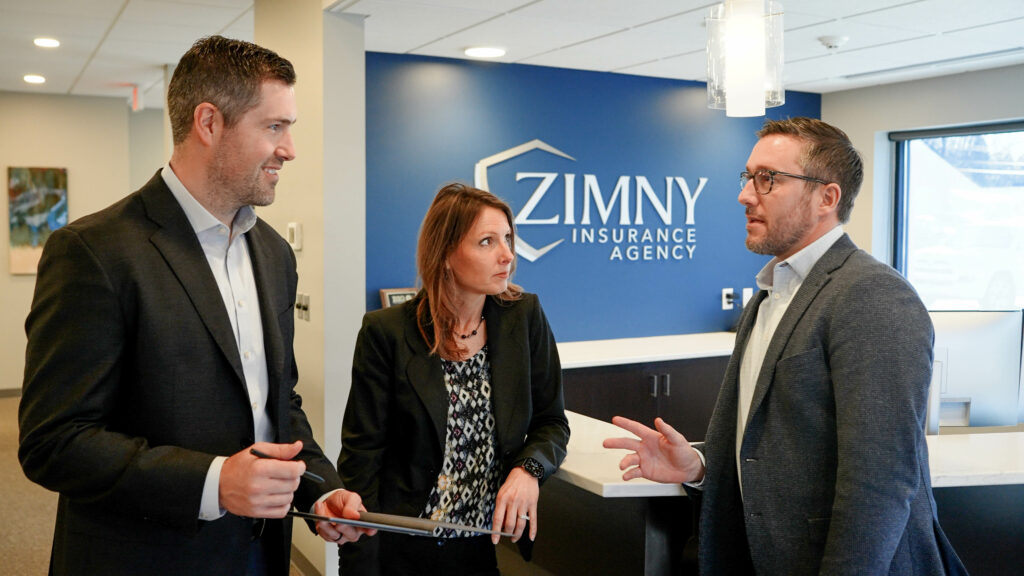 zimny insurance agency staff members chatting in office